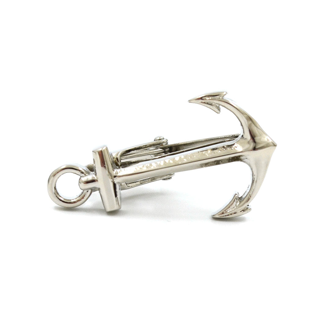 Silver anchor tie bar over white background