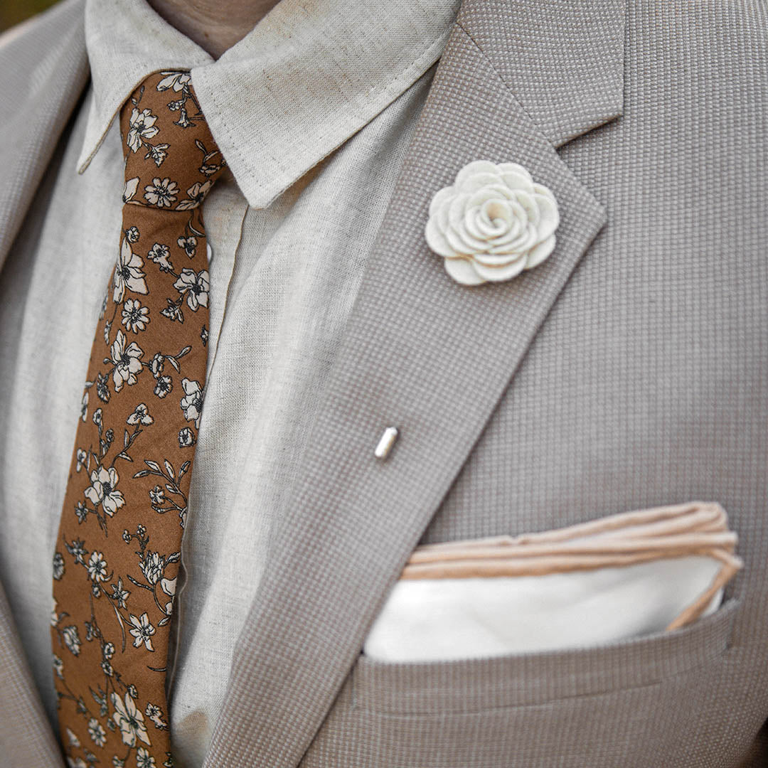 Tan suit and floral brown wedding tie with linen shirt