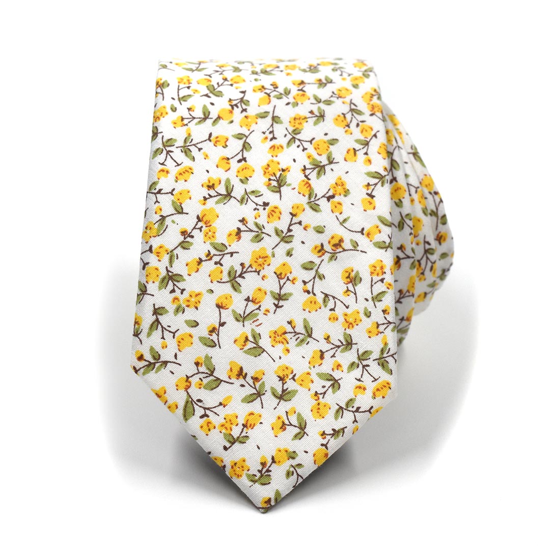 The floral marigold yellow tie rolled up