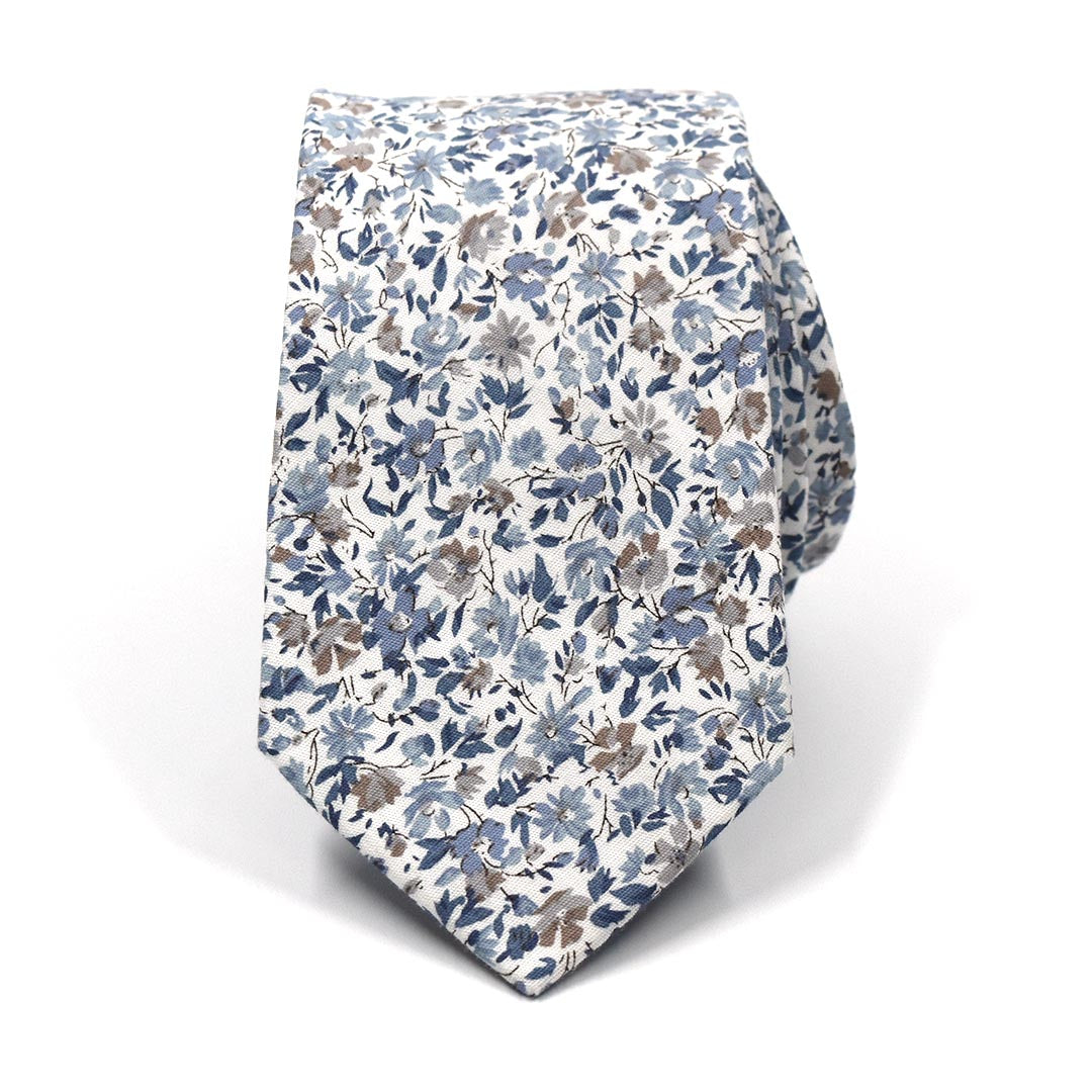 floral misty blue small print tie rolled up