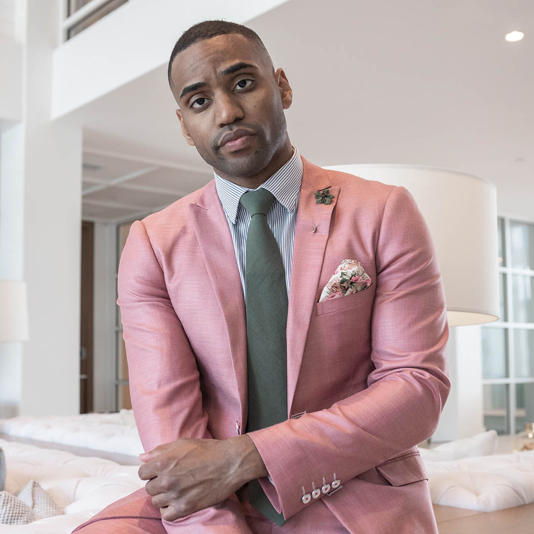 Solid Olive Tie set over a pink suit