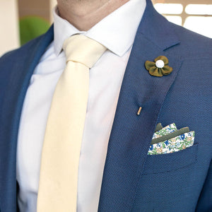 Microsuede Canary Ivory Tie in a blue suit