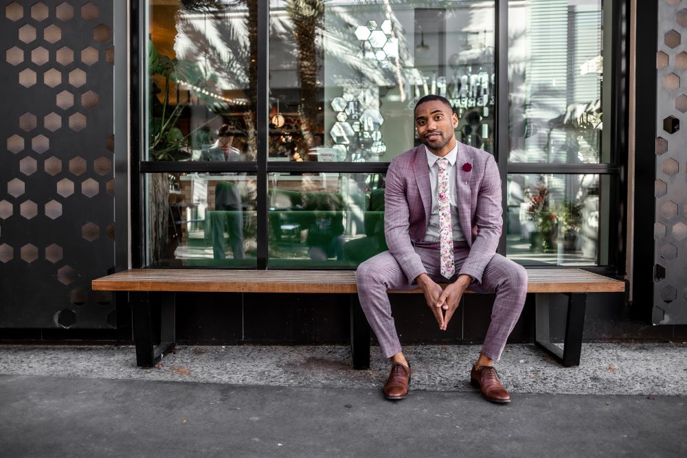 A man sitting wearing a tie