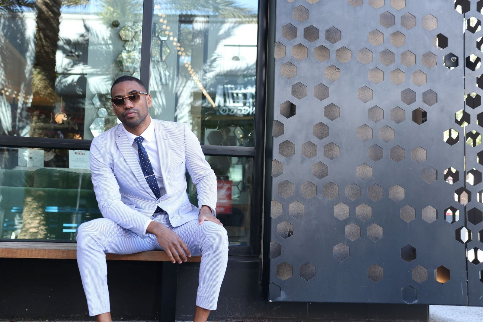 A man sitting wearing a tie