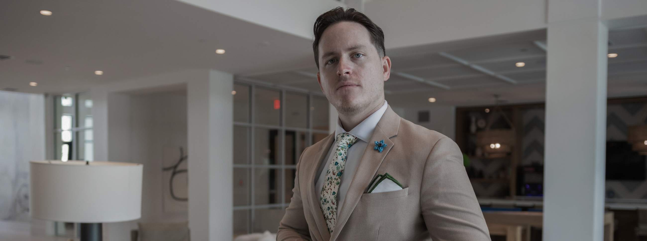 A man in a suit standing