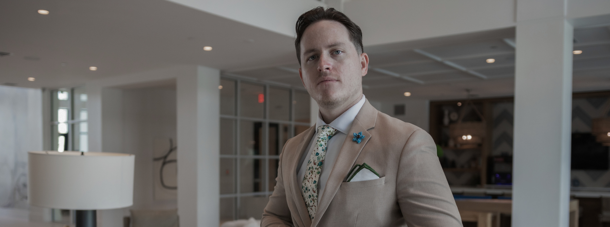A man in a suit standing