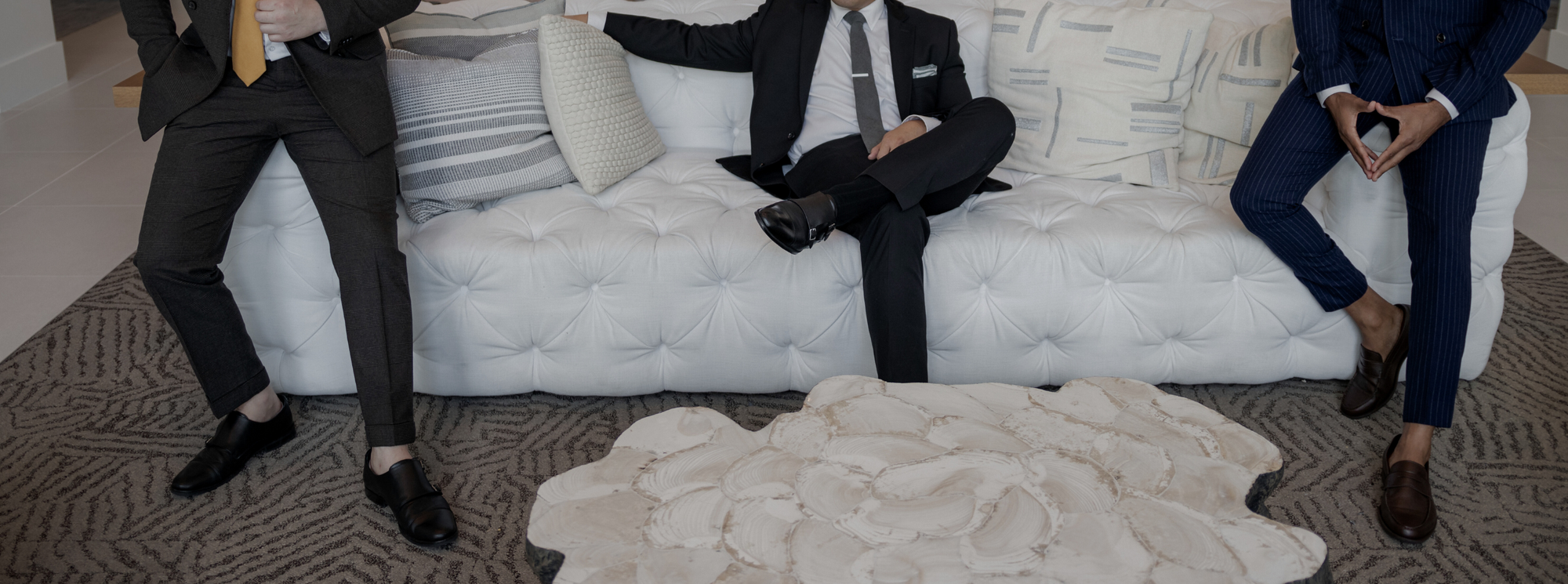 Three gentlemen sitting on a couch