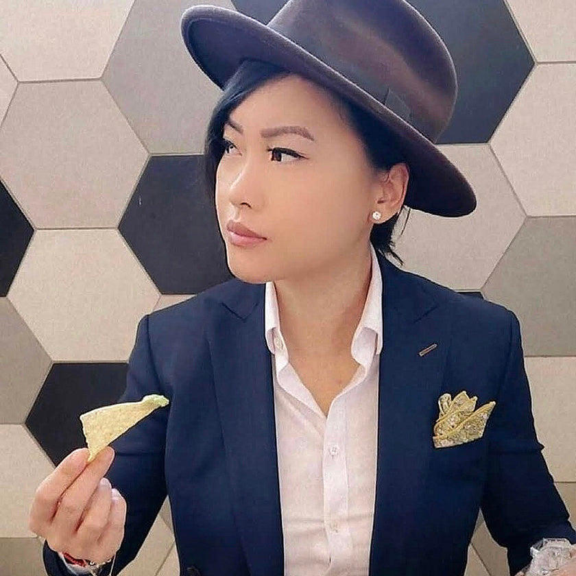 girl wearing hat and pocket square