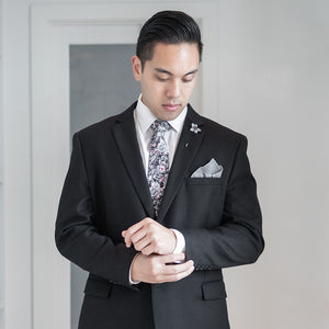 Man wearing black suit and the Floral Black Tie Set