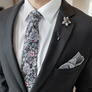 Man wearing black suit and the Floral Black Tie Set