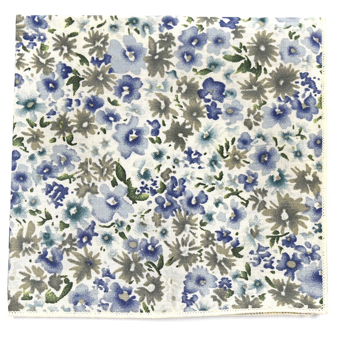 Floral patterned fabric with blue and green flowers on a white background
