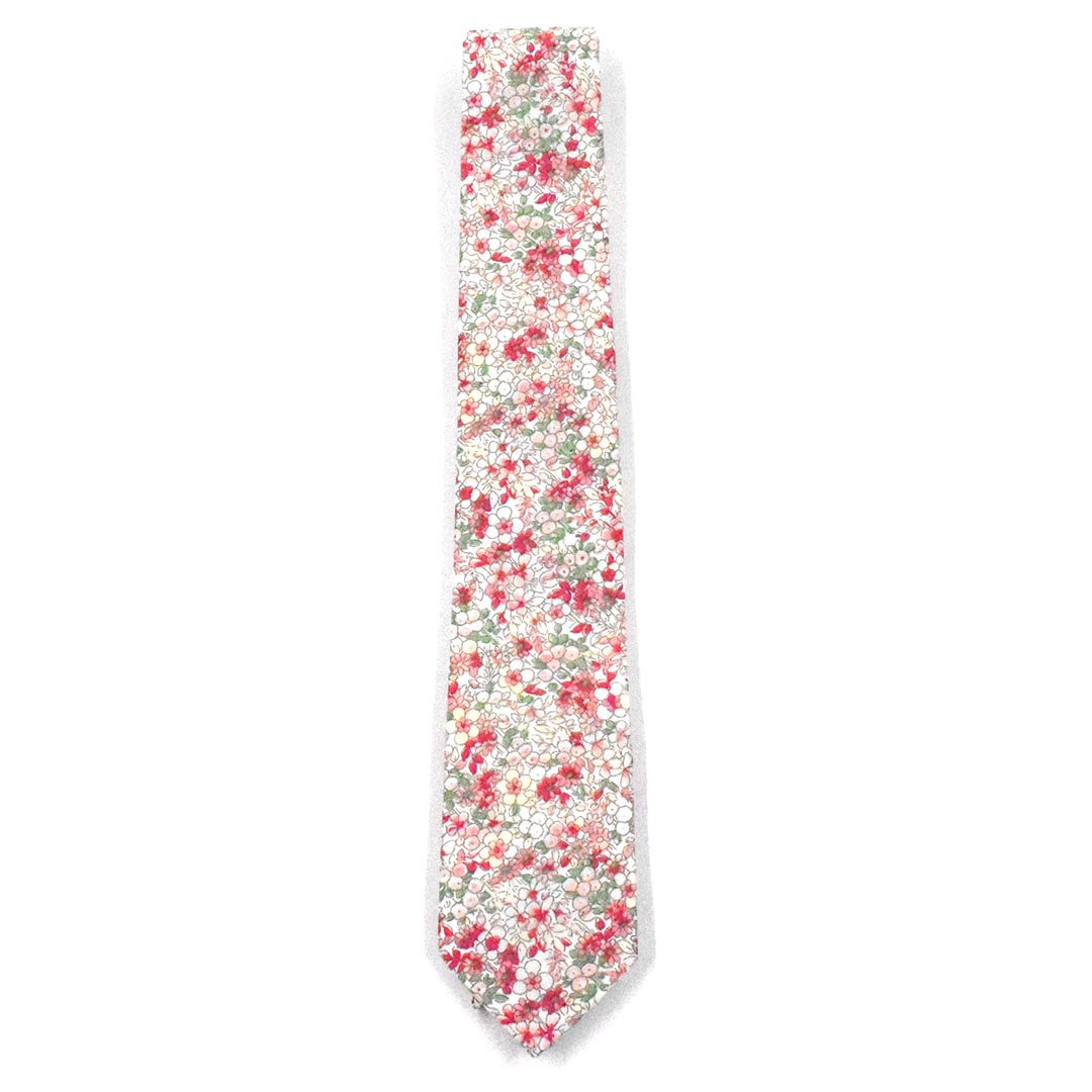 the floral coral pink tie laid out