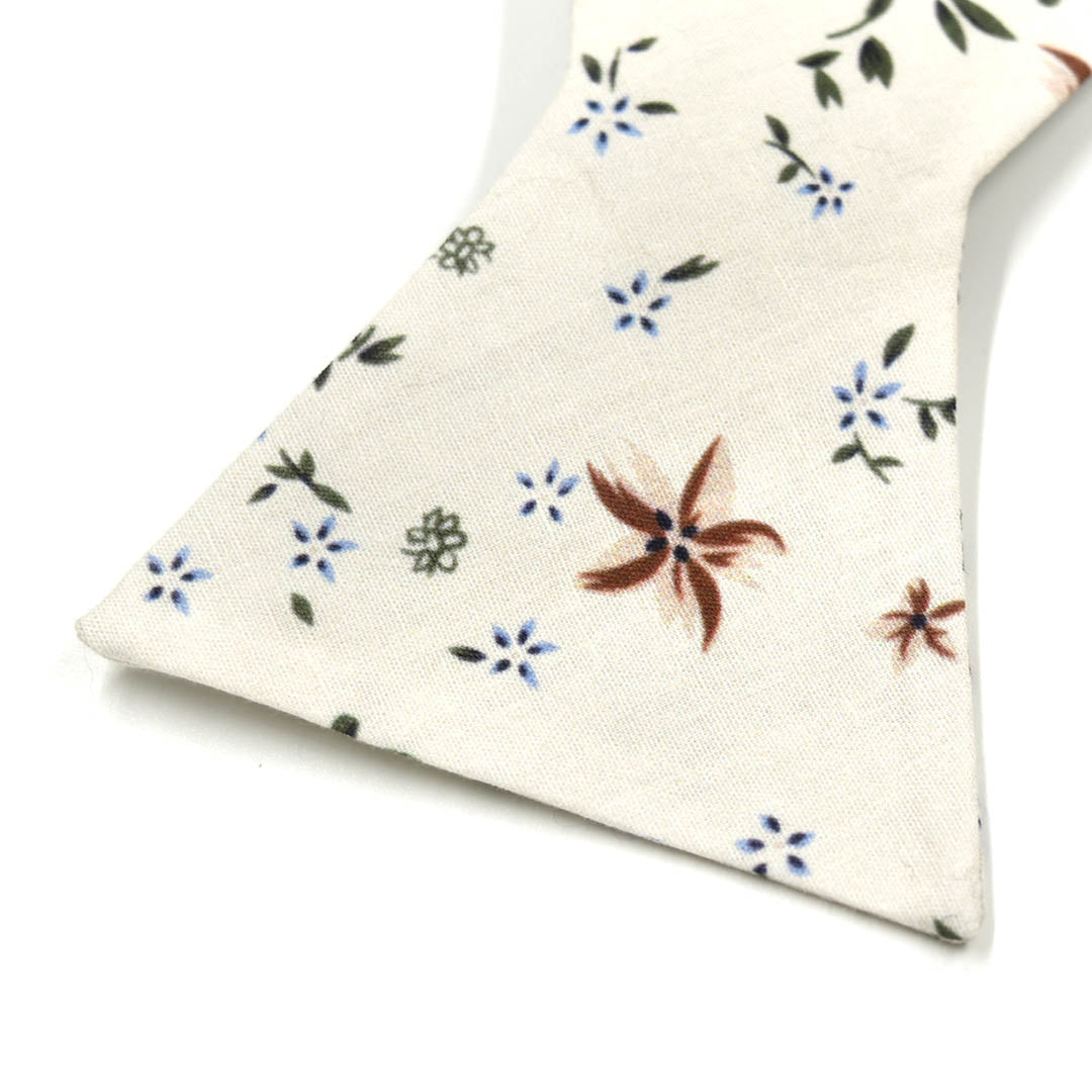 Detail shot of floral desert cream cotton fabric