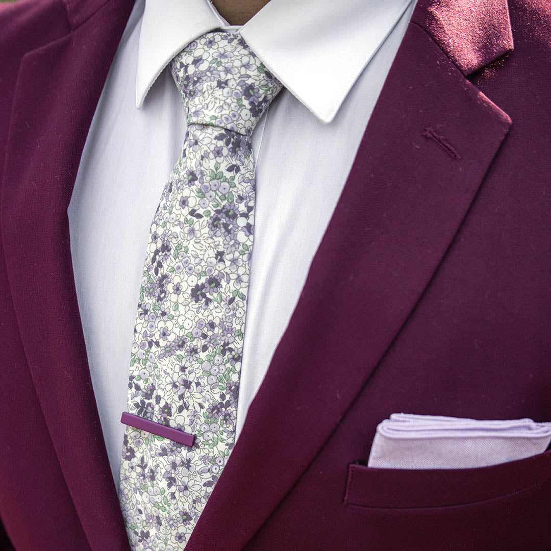 Man wearing a maroon suit with a Floral Lavender Tie