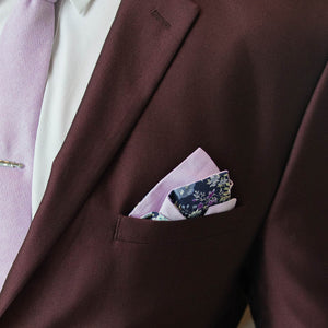 Floral linen pink reversible pocket square in a burgundy suit pocket