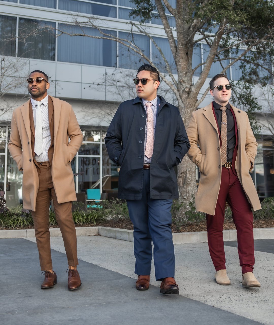 3 Gentleman wearing winter suits in an urban environment