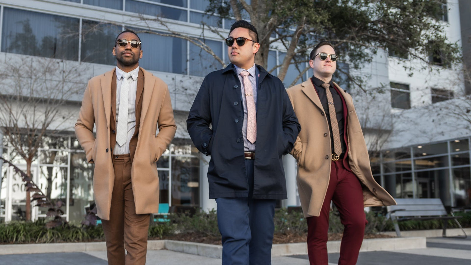 3 Gentleman dressed in winter suiting outside in an urban environment