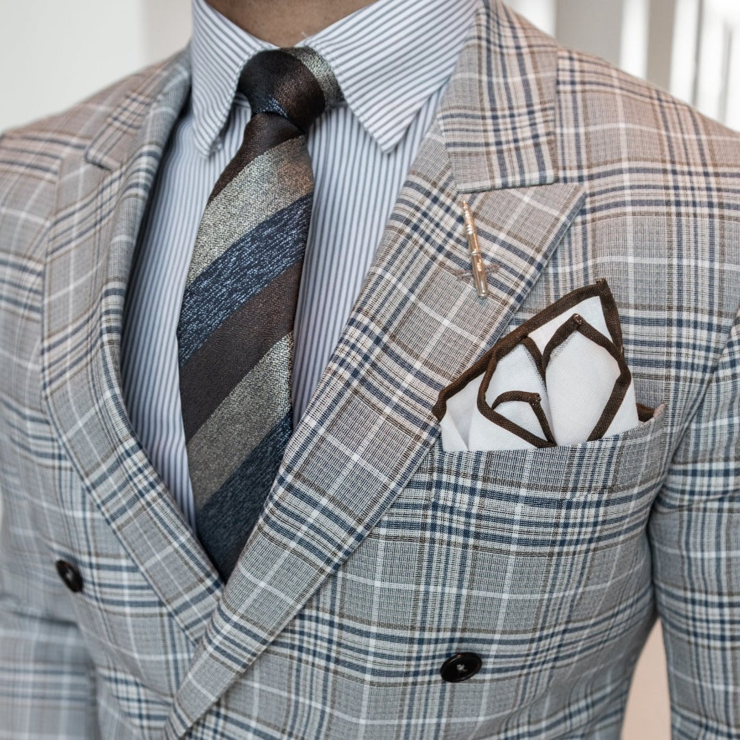 Man wearing brown and blue plaid suit with the Triple Stripe Earth Metals Tie Set