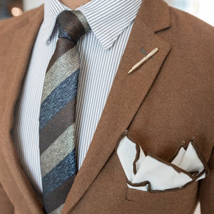Triple stripe earth metals tie set over brown suit