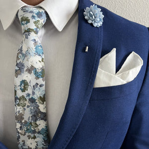 Gentleman wearing a floral dusty blue and light blue tie