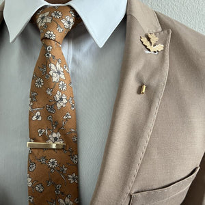 Gentleman wearing a brown and beige floral tie