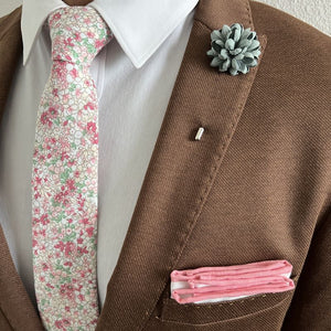 model posing in the floral coral pink tie