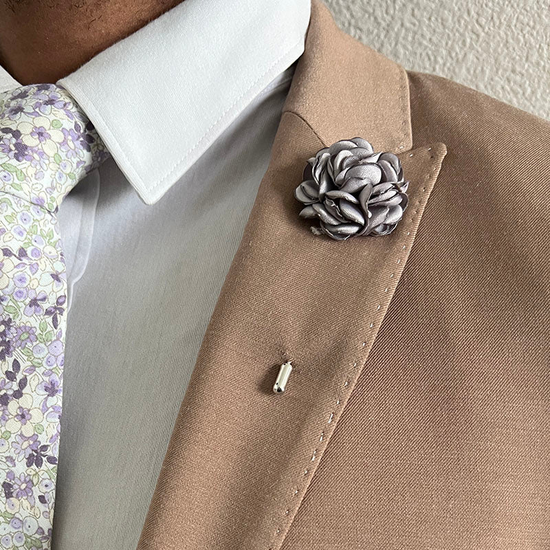 Grey Rose Lapel Pin paired with a dark tan suit and a floral lavender tie.