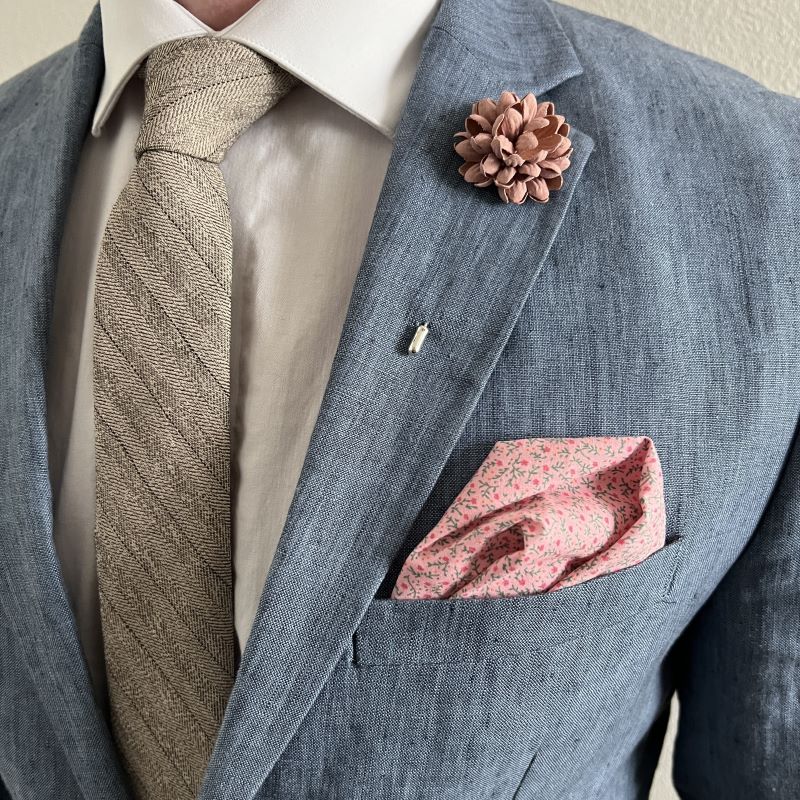 model wearing the hyacinth bud blush lapel pin