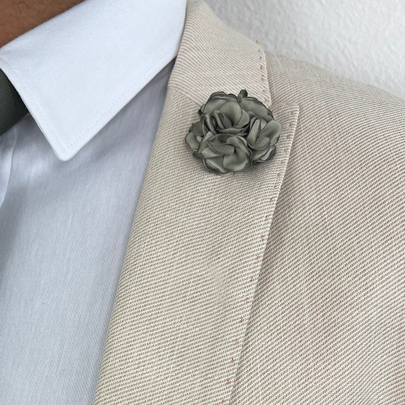 Sage Green Rose Lapel Pin on a Light Tan Suit Lapel Close Uo