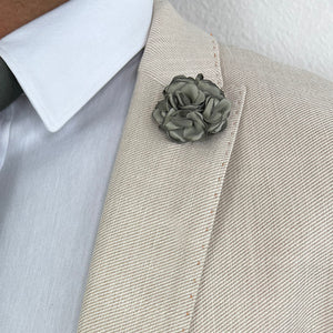 Sage Green Rose Lapel Pin on a Light Tan Suit Lapel Close Uo