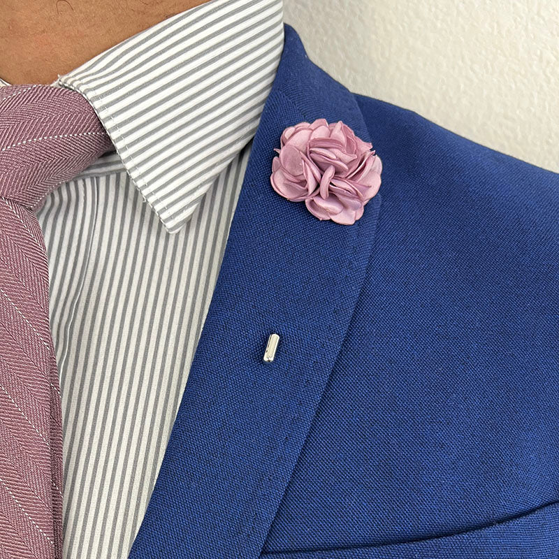 Mauve Rose Lapel Pin with a Blue Suit