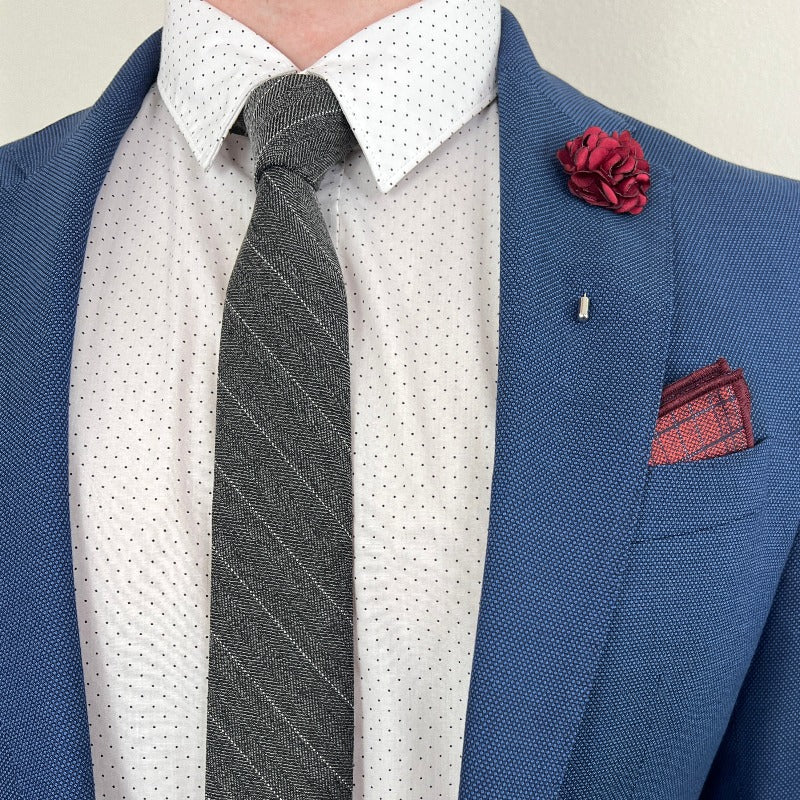 Pinstripe Chevron Charcoal Tie with a blue suit and Red Rose Lapel Pin