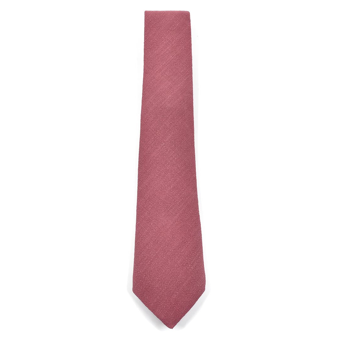 Pink textured tie on a white background