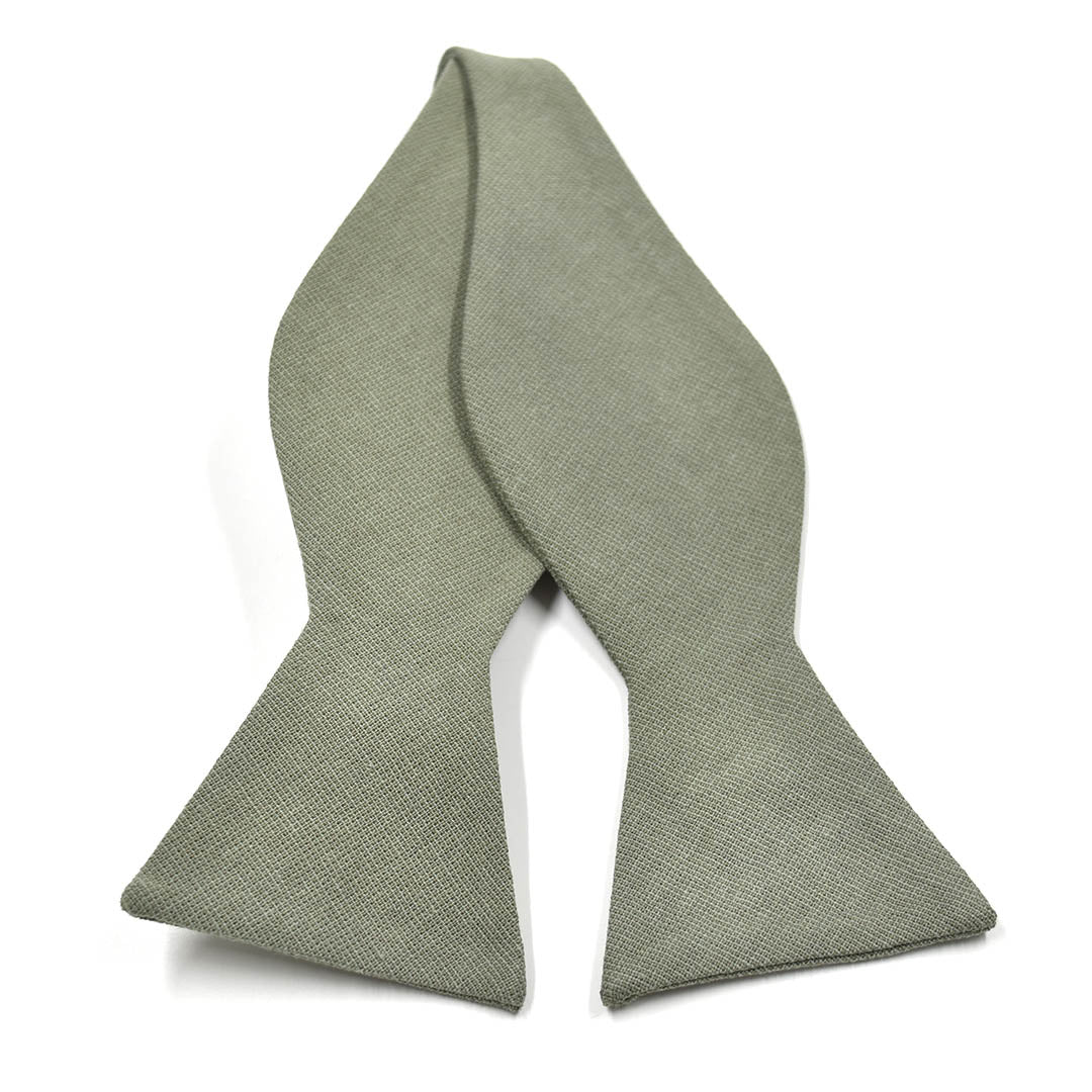 Green textured bow tie on a white background