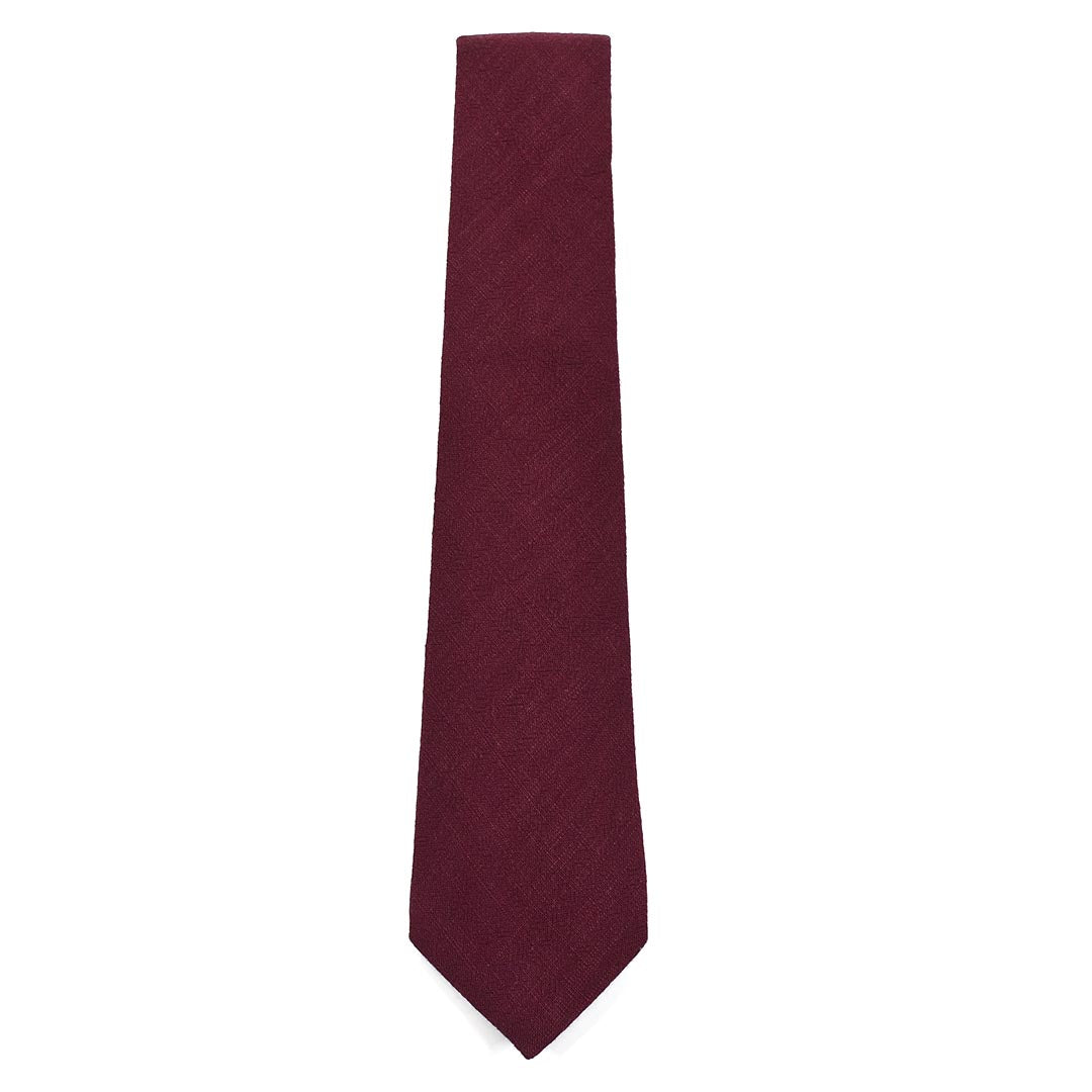 Maroon tie on a white background