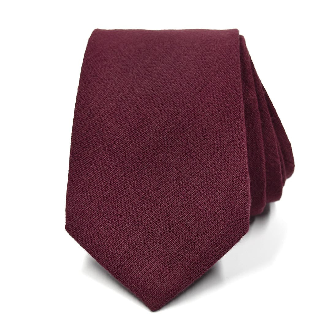 Maroon tie on a white background