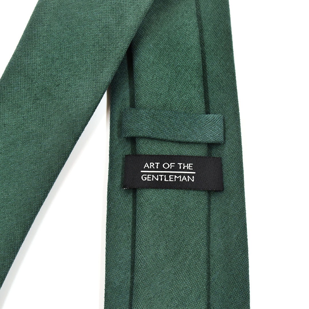 Emerald Green tie with a label reading 'Art of the Gentleman' on a white background