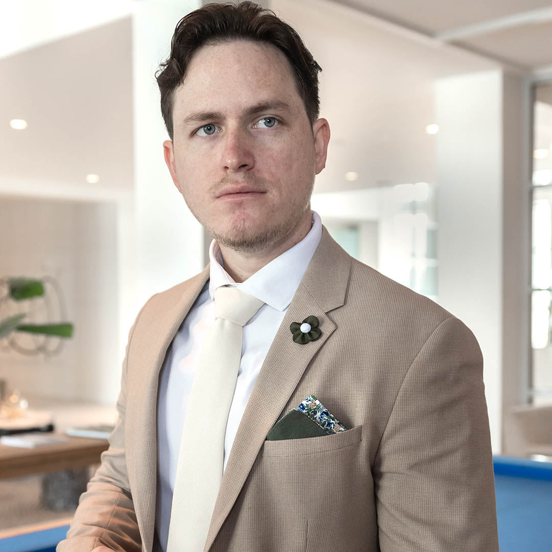 Microsuede Canary Ivory Tie in a tan suit