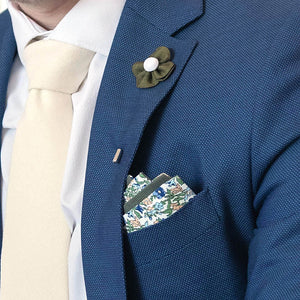 Olive floral reversible pocket square in navy suit pocket