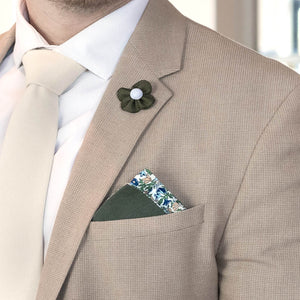 Pearl Floral Olive Lapel Pin on a tan suit lapel