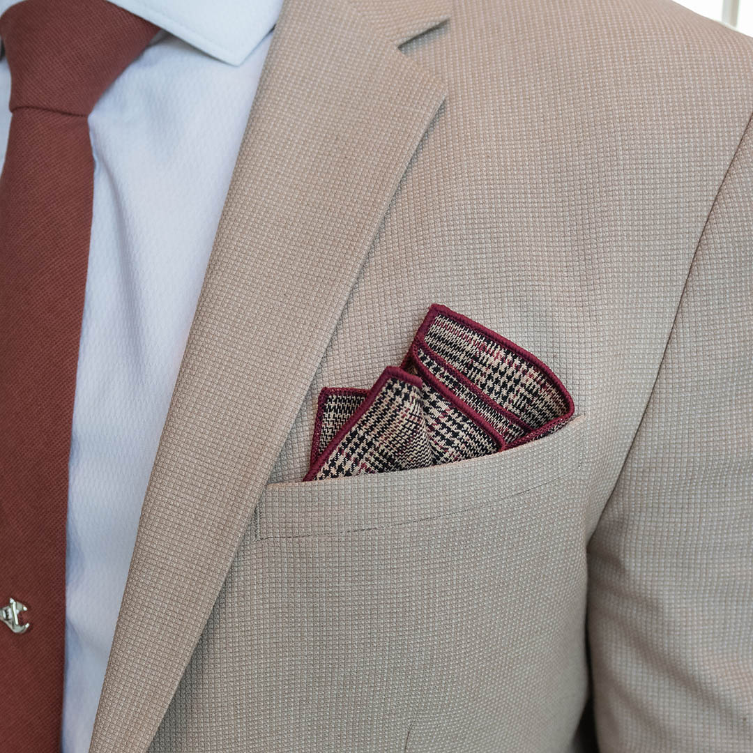 Plaid Checkmate Tan Pocket Square. Beige background with a glen check black and burgundy overlay. Burgundy border stitching.