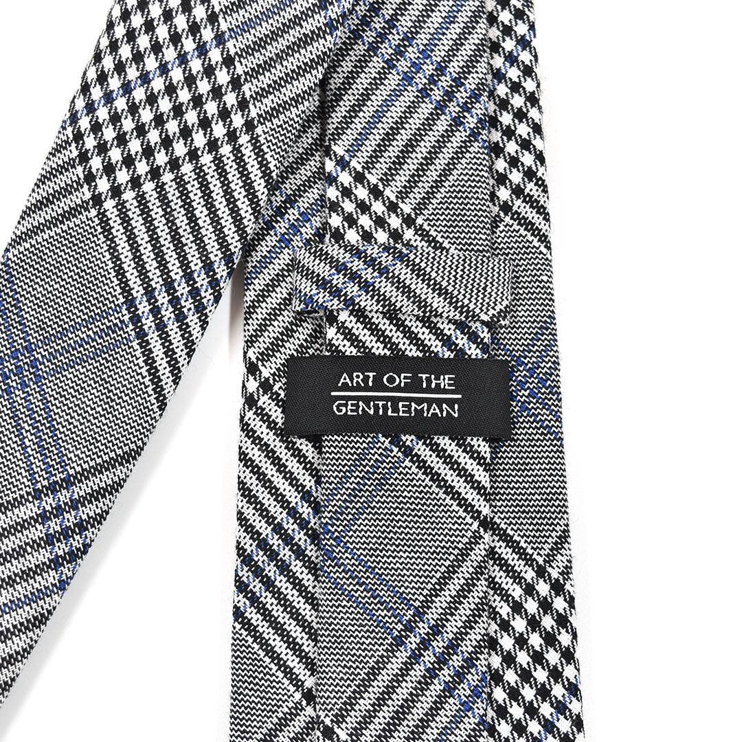 Plaid Prince of Wales Tie with 'Art of the Gentleman' label on a white background