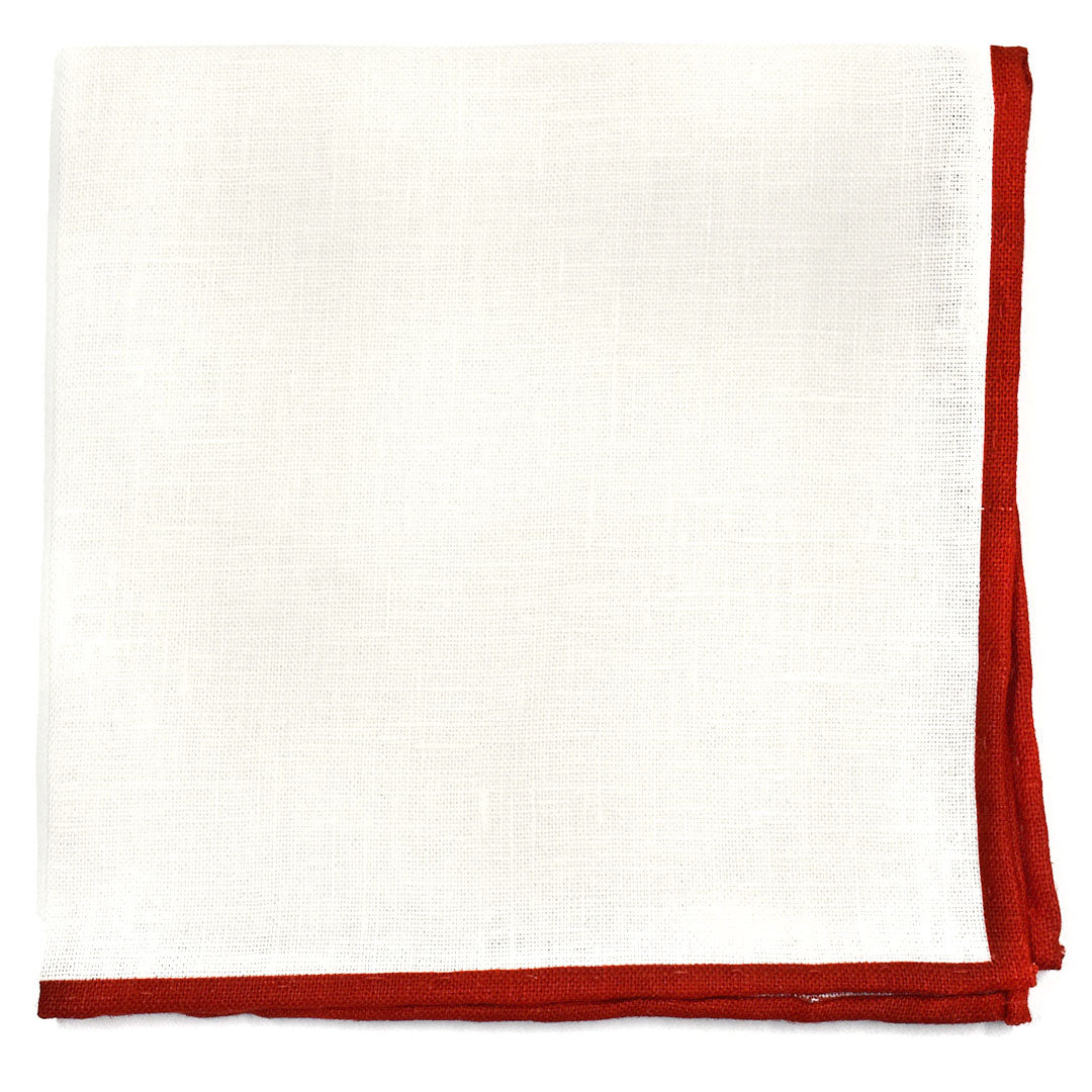 Folded linen pocket square with a red border