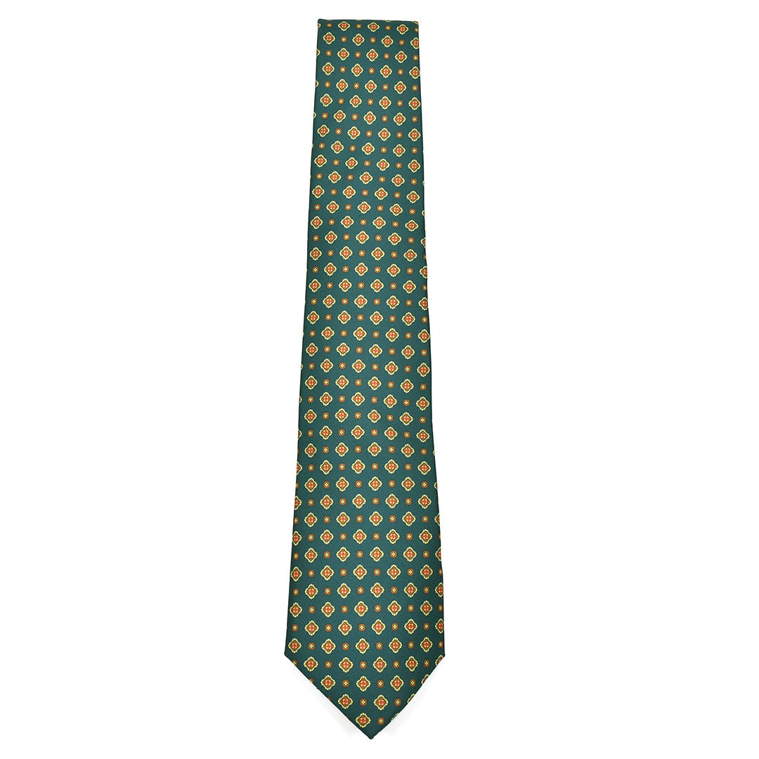 Green tie with orange geometric pattern on a white background
