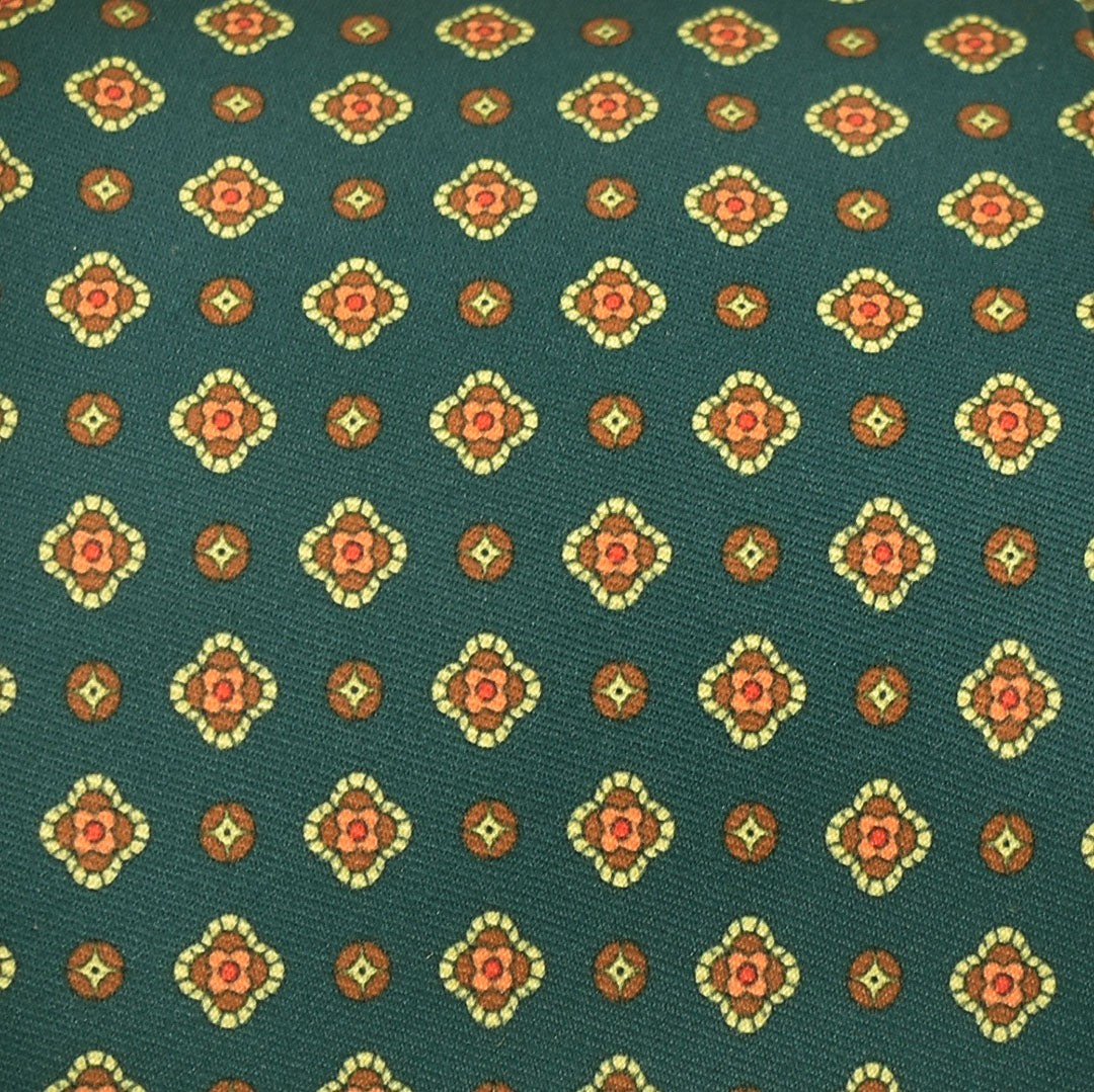 Patterned fabric with geometric design on a green background