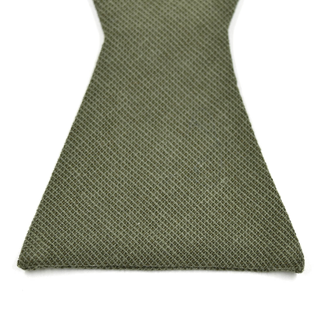 Close up picture of cotton solid olive fabric