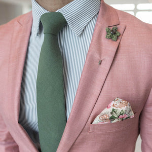 Solid Olive Tie set over a pink suit