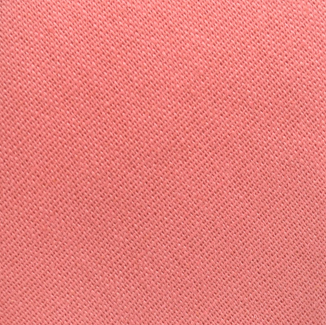 Coral pink color swatch with a textured pattern