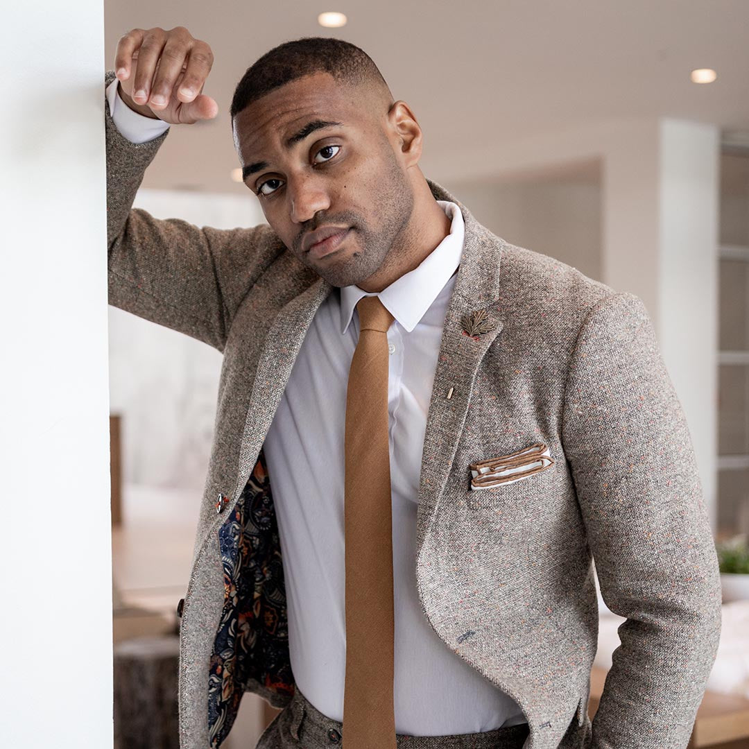 Solid Brown Tie Set on model wearing brown suit in an office building
